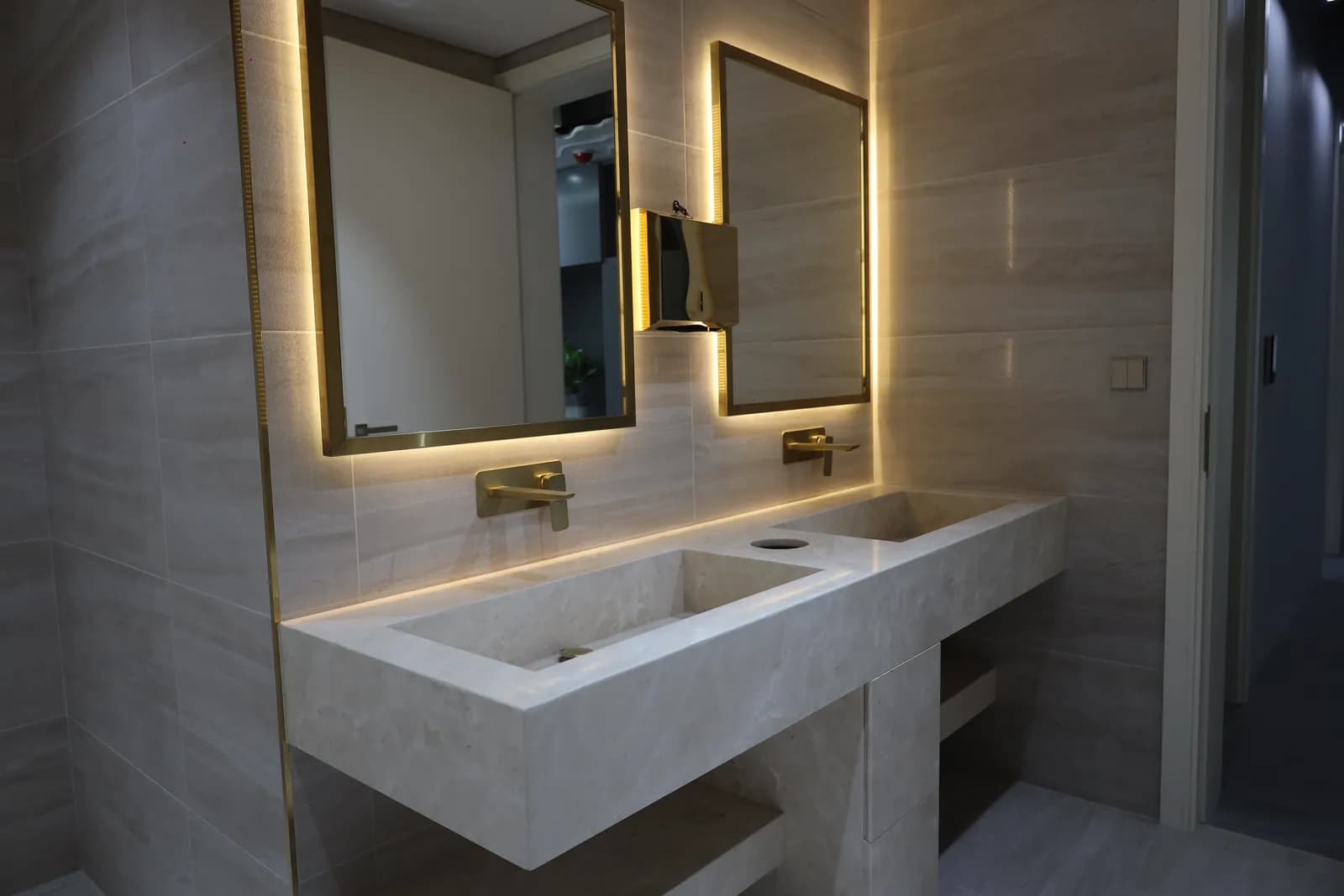 Finished bathroom – stone cladding and a glass shower enclosure